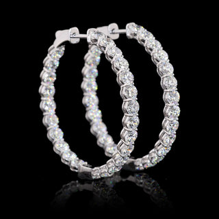 Round 4.8 CTW lab-grown diamond inside-out hoop earrings, 32mm, with 48 sparkling diamonds in white gold finish.