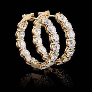 Round lab-grown diamond inside-out hoop earrings, 25mm, 6 carats total weight, yellow gold setting, 24-piece design.