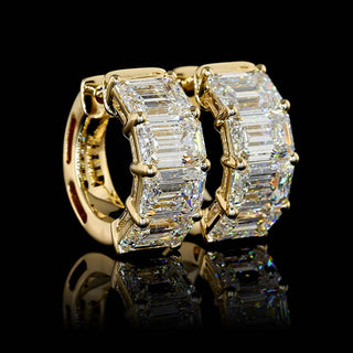 East-West emerald lab-grown diamond huggie earrings with 4 carats total weight, 15.6mm size, set in yellow gold.