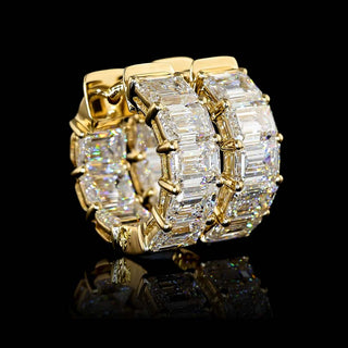 East-West emerald lab-grown diamond huggie earrings with inside-out design, 5 carats total weight, 16.3mm size, yellow gold finish.