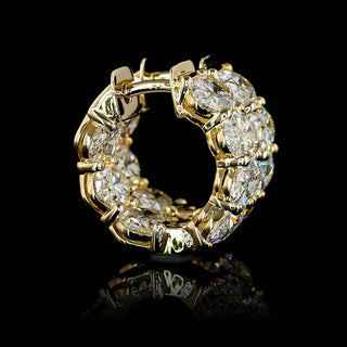 East-West oval lab-grown diamond huggie earrings with inside-out design, 5 carats total weight, 14k yellow gold cover.