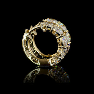 Pair of 2 carat total weight round lab-grown diamond huggie earrings with yellow gold covers, 14.75mm size, 10-piece set.