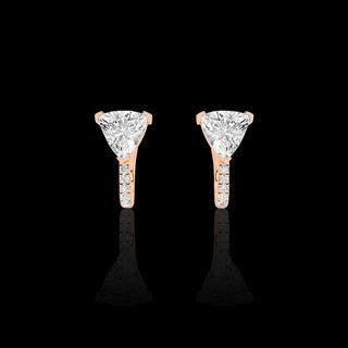 Lab-grown diamond huggie earrings with trillion and pave designs, 1.5 carats total weight, vibrant pink gold finish.