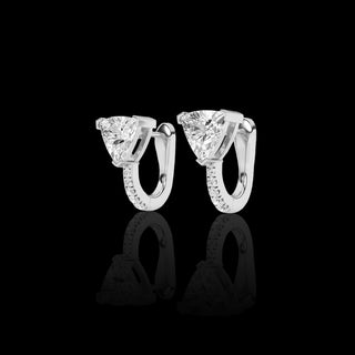 Lab-grown diamond huggie earrings with trillion and pave design, 1.5cttw, in white gold featuring sparkling gemstones.