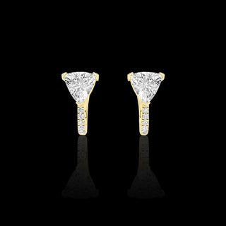 Gold lab-grown diamond huggie earrings featuring trillion-cut and pave-set diamonds, 1.5 carats total weight.
