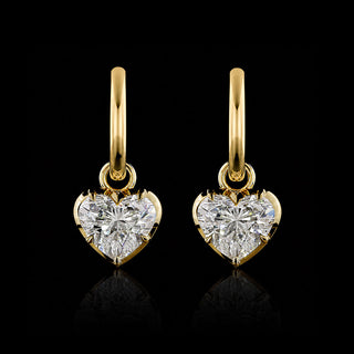 A pair of yellow gold heart shaped huggie drop earrings with 2 carat each heart diamonds in a georgian bezel-prong setting.