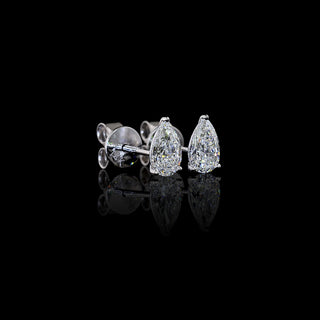 Side view of Pear-shaped lab grown diamond stud earrings in 14k white gold, prong setting, 1 CTW (0.5 carats each).