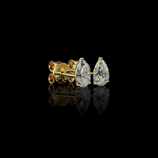 Side view of Pear-shaped lab grown diamond stud earrings in 14k yellow gold, prong setting, 1 CTW (0.5 carats each).