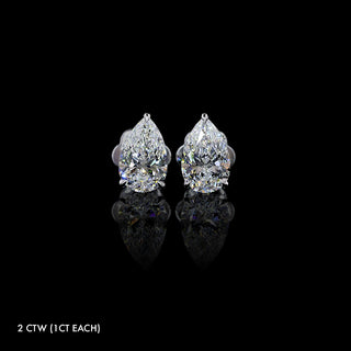 Pear-shaped lab grown diamond stud earrings in 14k white gold, claw prong setting, 2 carats total (1 carat each).