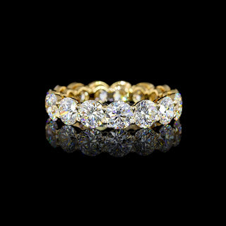 Round lab-grown diamond eternity band with 5 carats total weight in yellow gold, size 6, featuring sparkling round cut diamonds.