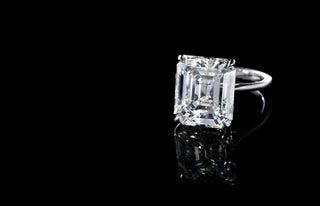 Emerald Cut Solitaire Lab Grown Diamond Engagement Ring on a black background 