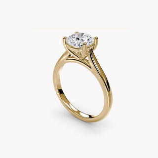 Cathedral solitaire engagement ring setting in yellow gold with a cushion-cut lab grown diamond, three-quarter view. || #metal_yellow gold #diamond shape_cushion