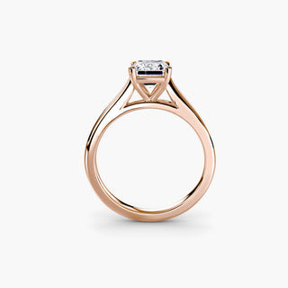 Cathedral solitaire engagement ring setting in rose gold, side profile view, featuring an emerald-cut lab grown diamond. || #metal_rose gold #diamond shape_emerald