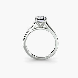 Cathedral solitaire engagement ring setting in white gold, side profile view, featuring an emerald-cut lab grown diamond. || #metal_white gold|platinum #diamond shape_emerald