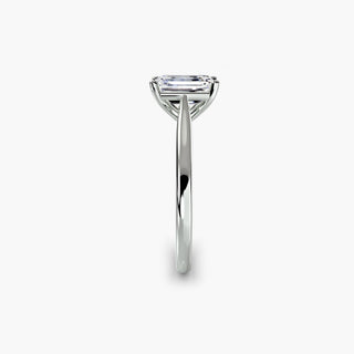 Cathedral solitaire engagement ring setting in white gold showing the tapered band profile, with an emerald-cut lab grown diamond. || #metal_white gold|platinum #diamond shape_emerald