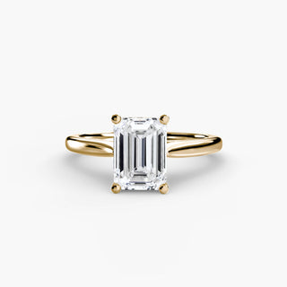 Cathedral solitaire engagement ring setting in yellow gold, featuring an emerald-cut lab grown diamond. || #metal_yellow gold #diamond shape_emerald