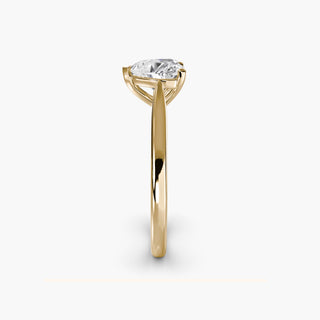 Cathedral solitaire engagement ring setting in yellow gold showing the tapered band profile, with a heart-shaped lab grown diamond. || #metal_yellow gold #diamond shape_heart