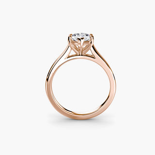Cathedral solitaire engagement ring setting in rose gold, side profile view, featuring a marquise-cut lab grown diamond. || #metal_rose gold #diamond shape_marquise