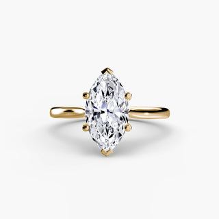 Cathedral solitaire engagement ring setting in yellow gold, featuring a marquise-cut lab grown diamond. || #metal_yellow gold #diamond shape_marquise