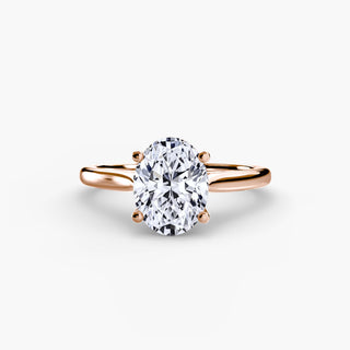 Cathedral solitaire engagement ring setting in rose gold, featuring an oval-cut lab grown diamond. || #metal_rose gold #diamond shape_oval
