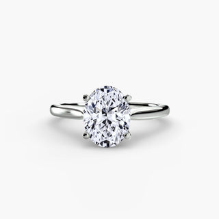 Cathedral solitaire engagement ring setting in white gold, featuring an oval-cut lab grown diamond. || #metal_white gold|platinum #diamond shape_oval