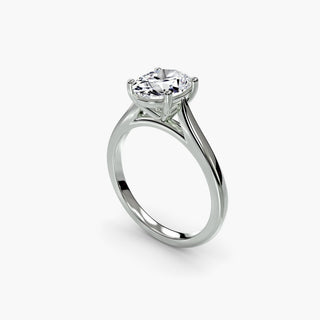 Cathedral solitaire engagement ring setting in white gold with an oval-cut lab grown diamond, three-quarter view. || #metal_white gold|platinum #diamond shape_oval