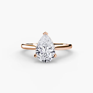 Cathedral solitaire engagement ring setting in rose gold, featuring a pear-shaped lab grown diamond. || #metal_rose gold #diamond shape_pear