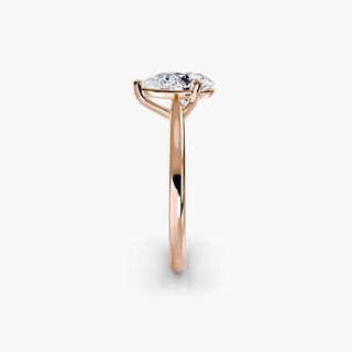 Cathedral solitaire engagement ring setting in rose gold showing the tapered band profile, with a pear-shaped lab grown diamond. || #metal_rose gold #diamond shape_pear