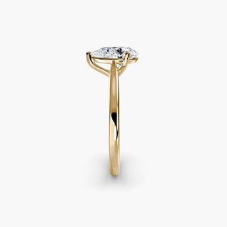 Cathedral solitaire engagement ring setting in yellow gold showing the tapered band profile, with a pear-shaped lab grown diamond. || #metal_yellow gold #diamond shape_pear