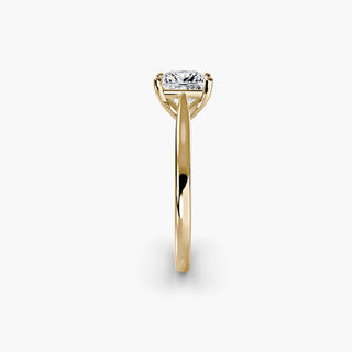 Cathedral solitaire engagement ring setting in yellow gold showing the tapered band profile, with a princess-cut lab grown diamond. || #metal_yellow gold #diamond shape_princess