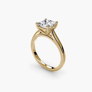 Cathedral solitaire engagement ring setting in yellow gold with a princess-cut lab grown diamond, three-quarter view. || #metal_yellow gold #diamond shape_princess
