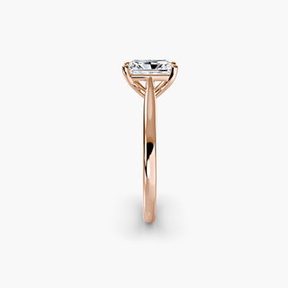 Cathedral solitaire engagement ring setting in rose gold showing the tapered band profile, with a radiant-cut lab grown diamond. || #metal_rose gold #diamond shape_radiant