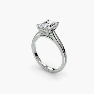 Cathedral solitaire engagement ring setting in white gold with a radiant-cut lab grown diamond, three-quarter view. || #metal_white gold|platinum #diamond shape_radiant