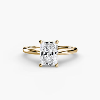 Cathedral solitaire engagement ring setting in yellow gold, featuring a radiant-cut lab grown diamond. || #metal_yellow gold #diamond shape_radiant