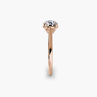 Cathedral solitaire engagement ring setting in rose gold showing the tapered band profile, with a round lab grown diamond. || #metal_rose gold #diamond shape_round
