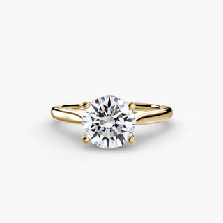 Cathedral solitaire engagement ring setting in yellow gold, featuring a round lab grown diamond. || #metal_yellow gold #diamond shape_round