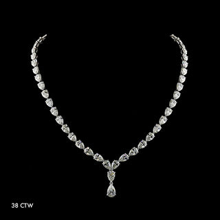 Pear drop-shaped lab-grown diamond necklace with 3.8 carat total weight, 1.25 carat center stone, 16-inch white gold chain.