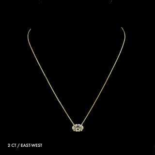 Oval lab-grown diamond solitaire pendant necklace with 2 carats in yellow gold, showcasing a sparkling gemstone and elegant chain.