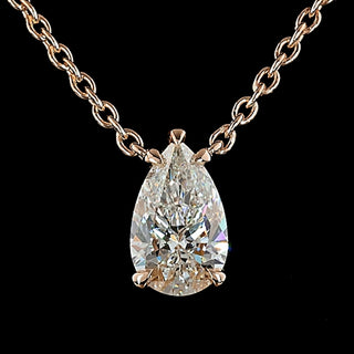 Pear-shaped lab-grown diamond solitaire pendant necklace with 1.5 carats on a silver chain.
