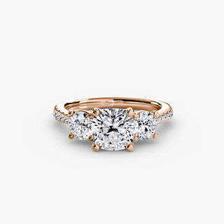 LabGrownDiamonds.com three-stone cathedral pavé engagement ring setting with cushion-cut center and intricate metalwork.