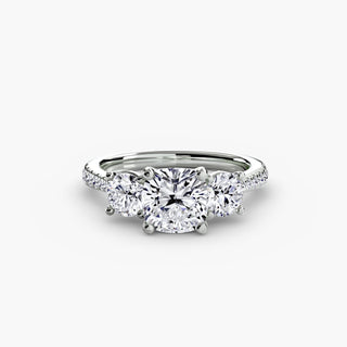 Three stone cathedral pave engagement ring setting with cushion-cut center, crafted by LabGrownDiamonds.com, showcasing intricate metalwork.