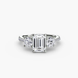 LabGrownDiamonds.com three stone cathedral pave engagement ring with emerald cut diamonds in white gold setting, shown from top-down view.
