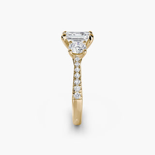 Three stone cathedral pave engagement ring setting with emerald-cut lab-grown diamonds, featuring side stones in yellow gold.
