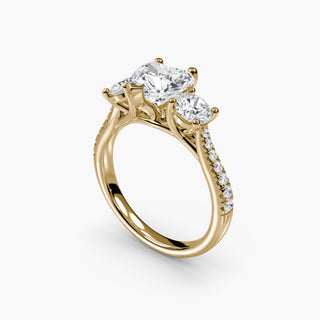 Three stone cathedral pavé engagement ring setting with yellow gold band featuring detailed side angles and intricate design.