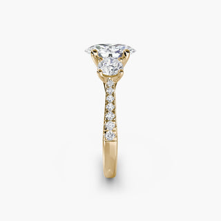 Three-stone cathedral pavé engagement ring setting with oval center and side stones, crafted by LabGrownDiamonds.com.