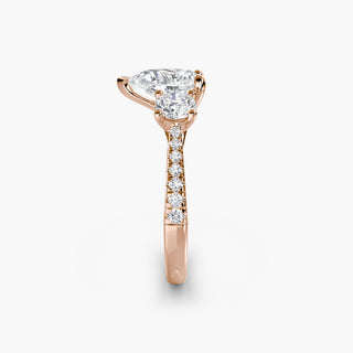Three stone cathedral pavé engagement ring setting with pear-shaped lab-grown diamonds, featuring intricate side detailing.