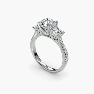Three stone cathedral pavé engagement ring setting with round diamonds in white gold, showcasing intricate craftsmanship from LabGrownDiamonds.com.