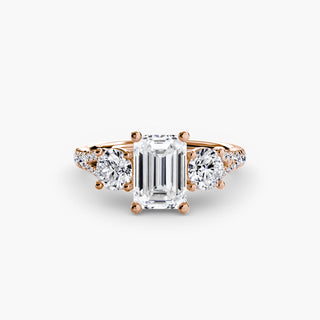 Three stone split shank pave engagement ring setting with emerald accent stones from LabGrownDiamonds.com, displayed from a downward angle.