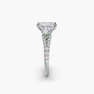 Three stone split shank pavé engagement ring setting with emerald-cut diamonds in white gold, showcasing intricate craftsmanship.