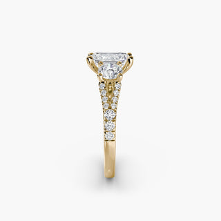 Three stone split shank pavé engagement ring setting with emerald accents, crafted by LabGrownDiamonds.com.